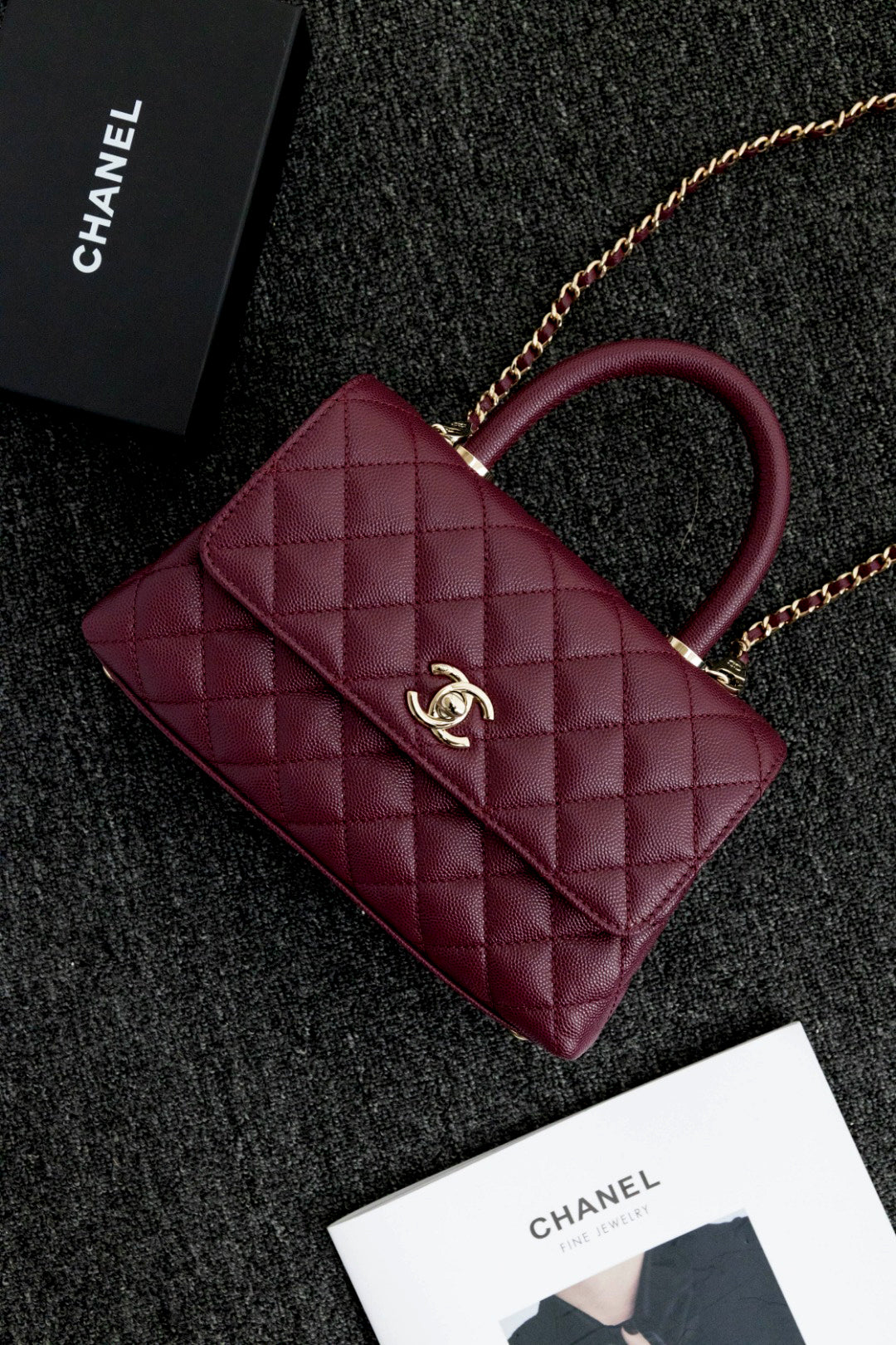 CH  FLAP BAG WITH TOP HANDLE 24  Small Grained Calfskin Red Wine Color