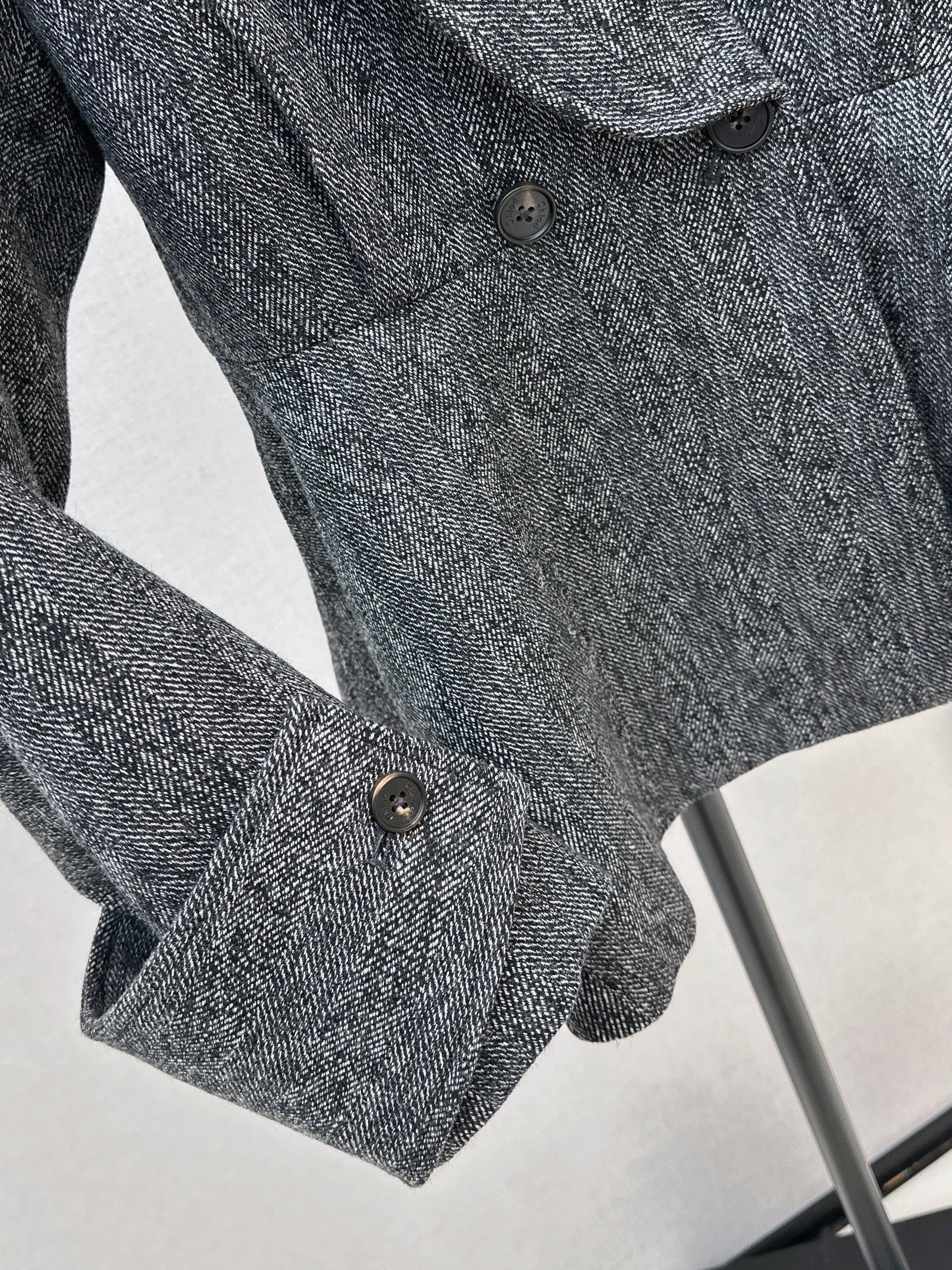 Chol 26ss ruffle-hem belted jacket